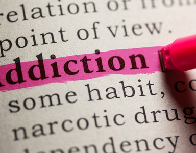 Page de livre où est surligné le mot Addiction